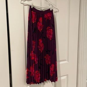 Maroon pleated skirt with floral pattern